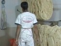 پخت و توزیع ۱۳۰۰ قرص نان صلواتی در روز شهادت امام مهربانی ها